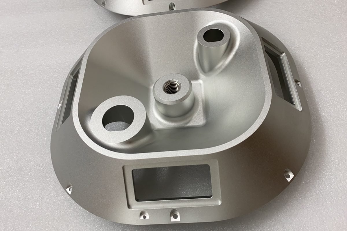 A machined aluminum component from a prototype run