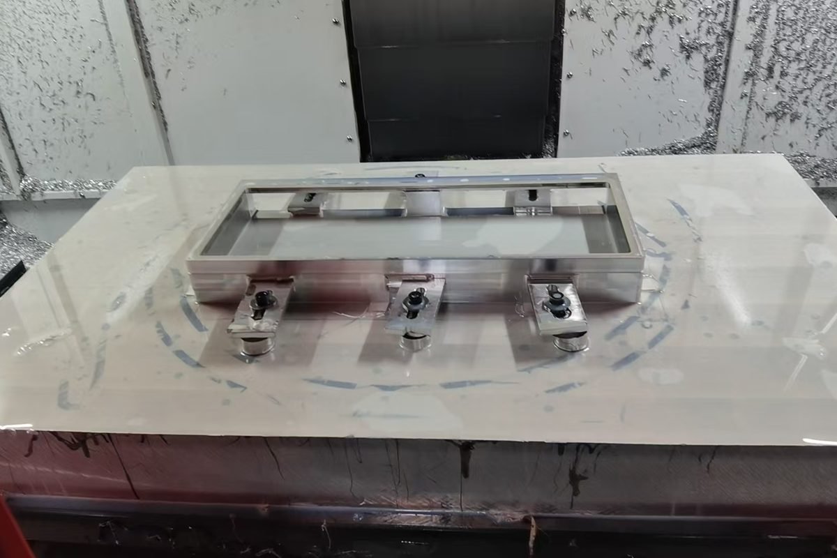 A component set up on the machine bed during machining